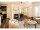 Comfortable living room with a fireplace, neutral decor, and hardwood floors at 5562 W 72Nd Pl, Westminster, CO 80003