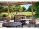 View from the pavilion with picnic tables and a built-in grill, ideal for outdoor dining at 5562 W 72Nd Pl, Westminster, CO 80003