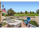 Backyard patio with comfortable seating and green space, perfect for outdoor relaxation and entertaining at 3668 Pecos Trl, Castle Rock, CO 80109