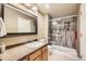 Beautiful bathroom featuring a glass shower, stylish vanity, and a large mirror at 3668 Pecos Trl, Castle Rock, CO 80109