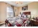 Inviting bedroom with a ceiling fan, natural light, and a comfortable bed at 3668 Pecos Trl, Castle Rock, CO 80109