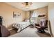 Comfortable bedroom with a ceiling fan, neutral colors, and artwork at 3668 Pecos Trl, Castle Rock, CO 80109