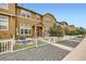 Attractive townhome exterior with a well-maintained front yard and a charming brick patio for outdoor enjoyment at 3668 Pecos Trl, Castle Rock, CO 80109