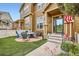 Charming front porch with brick patio, perfect for outdoor seating and enjoying the neighborhood view at 3668 Pecos Trl, Castle Rock, CO 80109