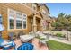 Inviting front porch featuring a brick patio with comfortable seating and a view of the neighborhood at 3668 Pecos Trl, Castle Rock, CO 80109