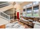 Spacious living room with high ceilings, a comfortable sofa, and ample natural light from large windows at 3668 Pecos Trl, Castle Rock, CO 80109