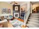 Cozy living room featuring a fireplace, comfortable seating, and stylish decor at 3668 Pecos Trl, Castle Rock, CO 80109