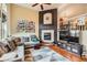 Inviting living room with a cozy fireplace, comfortable seating, and stylish decor at 3668 Pecos Trl, Castle Rock, CO 80109