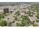 A scenic aerial view capturing a pond, residential buildings, and surrounding streets and traffic at 2840 S Kenton Ct, Aurora, CO 80014