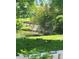 Scenic backyard view featuring a pond and lush green grass at 2840 S Kenton Ct, Aurora, CO 80014