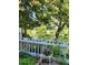 Backyard with a pond view, surrounded by lush greenery and plants at 2840 S Kenton Ct, Aurora, CO 80014
