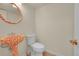 Quaint half-bath with unique pedestal sink and wood-look floors at 2840 S Kenton Ct, Aurora, CO 80014