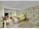 Bedroom featuring a large window, decorative wall paper, and a comfy bed at 2840 S Kenton Ct, Aurora, CO 80014