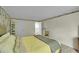 Bedroom with a comfy bed, decorative wall paper, and access to the outside at 2840 S Kenton Ct, Aurora, CO 80014