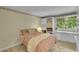 Bedroom featuring a large window, built in storage, and a comfy bed at 2840 S Kenton Ct, Aurora, CO 80014