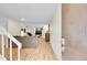 Inviting entryway with a staircase and light wood floors, leading to a cozy living space at 2840 S Kenton Ct, Aurora, CO 80014