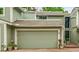 Charming townhome with a two-car garage and a well-manicured front yard, ready for its new owners at 2840 S Kenton Ct, Aurora, CO 80014