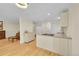Bright kitchen features modern cabinetry, light countertops and hardwood flooring at 2840 S Kenton Ct, Aurora, CO 80014