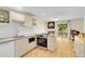 Bright kitchen features modern appliances and beautiful hardwood floors at 2840 S Kenton Ct, Aurora, CO 80014