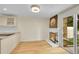 Cozy living space featuring a fireplace, hardwood floors, and a sliding door to the outside at 2840 S Kenton Ct, Aurora, CO 80014