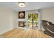 Bright living space with a fireplace, sliding glass doors to the patio, and hardwood floors at 2840 S Kenton Ct, Aurora, CO 80014