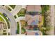 Aerial view of home with solar panels on roof in neighborhood with well-manicured lawns at 15960 W 62Nd Dr, Arvada, CO 80403