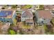 Aerial view of a gray two-story home with a covered patio, trampoline, and solar panels at 15960 W 62Nd Dr, Arvada, CO 80403