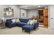 The finished basement features comfortable seating, recessed lighting, and a sauna at 15960 W 62Nd Dr, Arvada, CO 80403