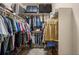 Organized walk-in closet with shelving and hanging rods provides ample storage space for clothes, shoes, and luggage at 15960 W 62Nd Dr, Arvada, CO 80403