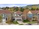 Two-story home with well-manicured lawn and mountain views, including solar panels at 15960 W 62Nd Dr, Arvada, CO 80403