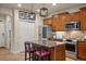 Well-equipped kitchen with stainless steel appliances, granite countertops, and a central island at 15960 W 62Nd Dr, Arvada, CO 80403