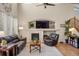 Cozy living room featuring a fireplace, comfortable seating, and stylish decor at 15960 W 62Nd Dr, Arvada, CO 80403