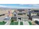 Two-story house with solar panels and landscaped yard, aerial view at 1781 Chestnut Ave, Erie, CO 80516