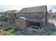 Home's back with patio, fire pit, and artificial turf at 1781 Chestnut Ave, Erie, CO 80516