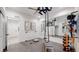 Bright and airy basement gym with a full-length mirror at 1781 Chestnut Ave, Erie, CO 80516
