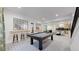 Finished basement features a pool table, bar area, and seating at 1781 Chestnut Ave, Erie, CO 80516