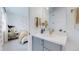 Small bathroom with single vanity, view of bedroom and gold fixtures at 1781 Chestnut Ave, Erie, CO 80516