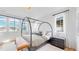 Comfortable bedroom with large windows and a canopy bed at 1781 Chestnut Ave, Erie, CO 80516