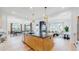 Open concept kitchen with large island and views into the living room at 1781 Chestnut Ave, Erie, CO 80516