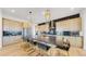 Modern kitchen with large island, stainless steel appliances, and dark countertops at 1781 Chestnut Ave, Erie, CO 80516