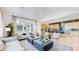 Open concept living and kitchen area with island at 1781 Chestnut Ave, Erie, CO 80516