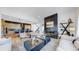 Open concept living room with modern fireplace and kitchen at 1781 Chestnut Ave, Erie, CO 80516