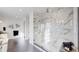 Large marble shower with glass enclosure and bench at 1781 Chestnut Ave, Erie, CO 80516