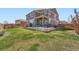 Lush backyard with a well-maintained lawn and a patio for outdoor living and entertaining at 9574 Keystone Trl, Parker, CO 80134