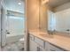 Well-lit bathroom showcasing a vanity, mirror, and bathtub with shower at 9574 Keystone Trl, Parker, CO 80134