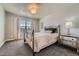 Comfortable bedroom featuring natural light and soft carpeting at 9574 Keystone Trl, Parker, CO 80134