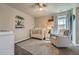 Charming Bedroom with a crib, cozy chair, and playful decor at 9574 Keystone Trl, Parker, CO 80134