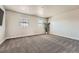 Spacious bonus room with large windows and plush carpeting at 9574 Keystone Trl, Parker, CO 80134