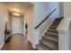 Inviting entryway featuring hardwood floors, a staircase with carpet, and neutral wall paint at 9574 Keystone Trl, Parker, CO 80134