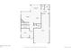 First floor plan showcasing a spacious layout with kitchen, living room, and garage at 9574 Keystone Trl, Parker, CO 80134